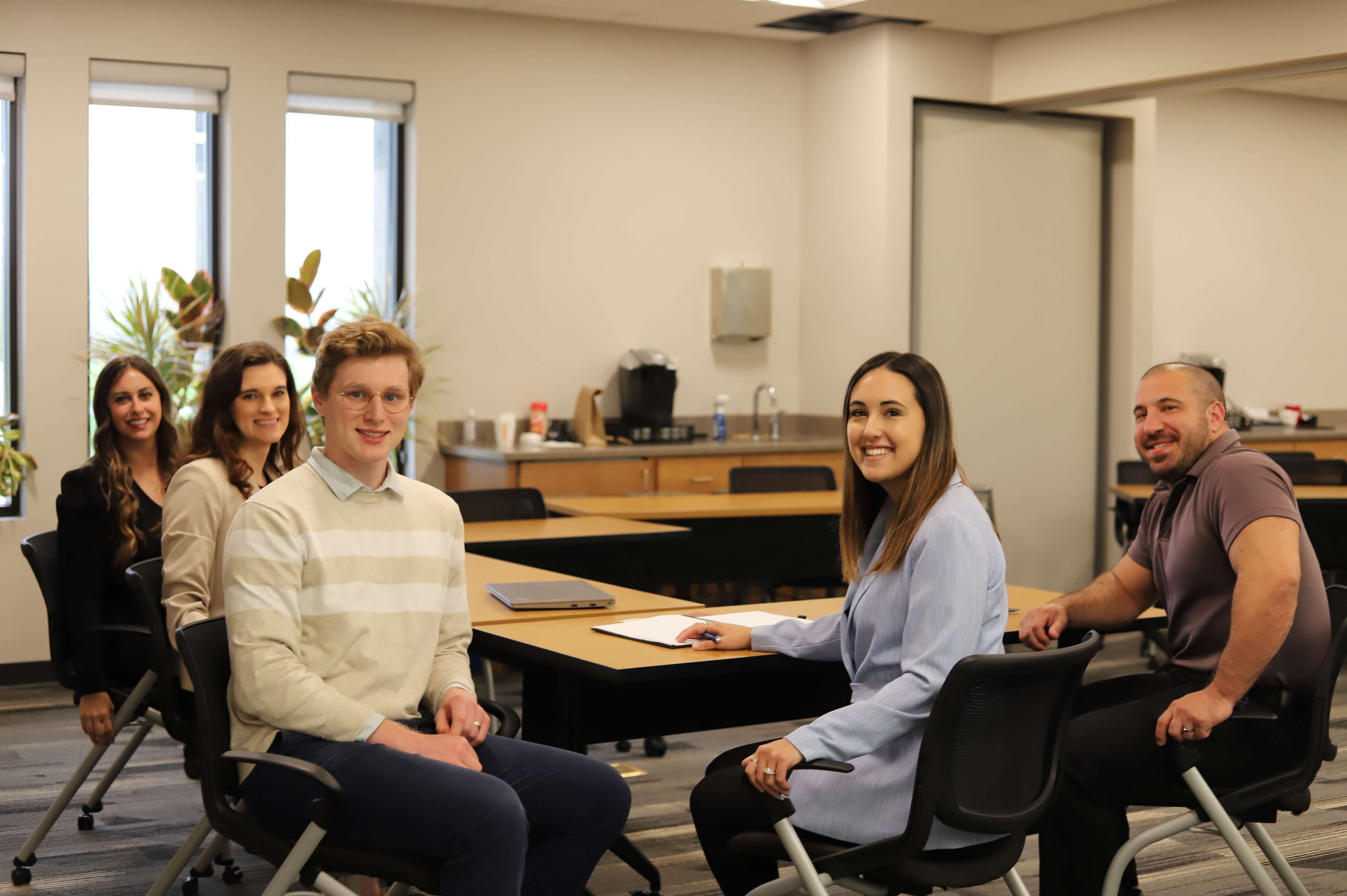 Group of Jarrett employees in a board room