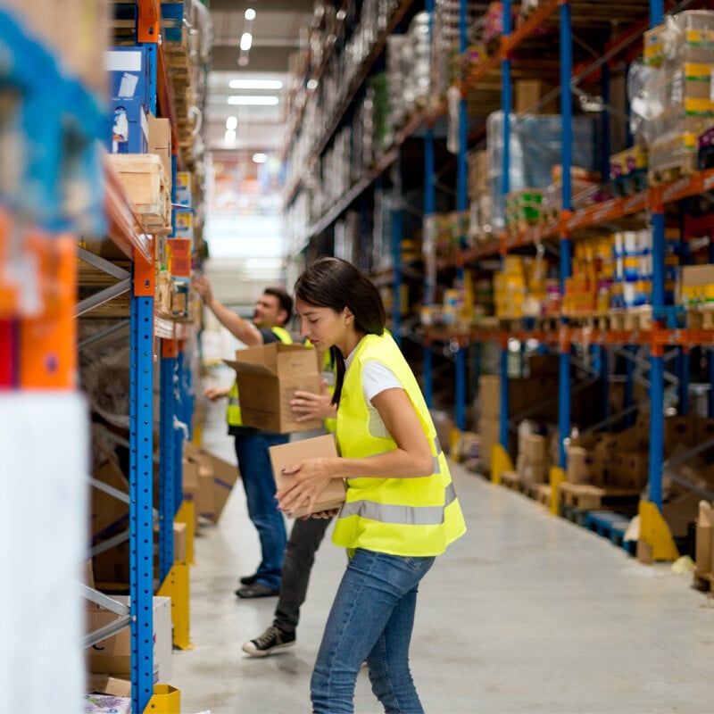 Warehouse workers packing boxes