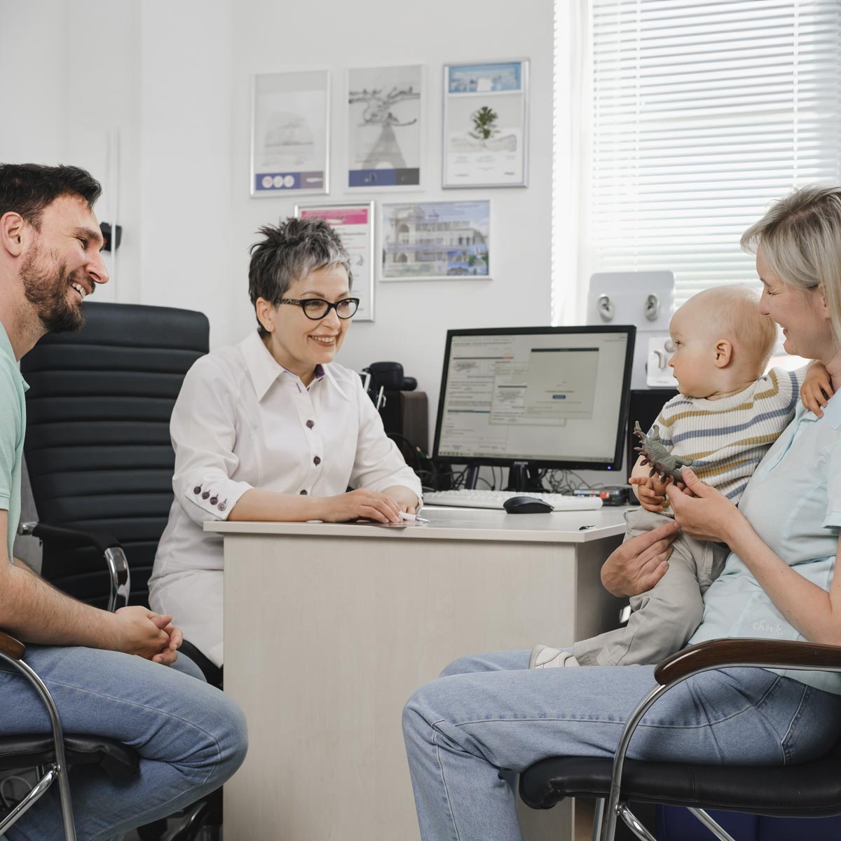 Family visiting doctor for baby checkup