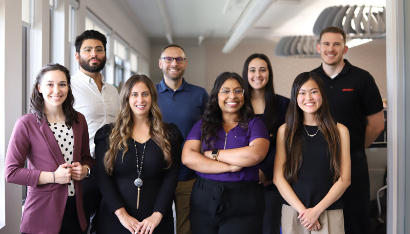 Jarrett team members posing together in the office