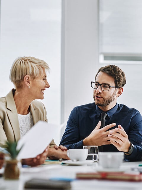 Shot of a group of businesspeople sitting together in a meeting