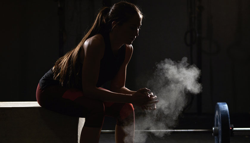 Woman resting after a hard crossfit workout