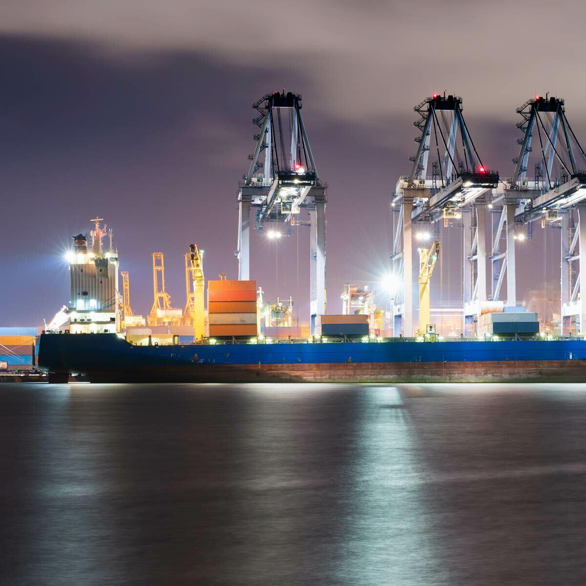 Large port loading a vessel with cargo